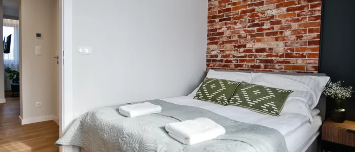Apartment for 4 - close up of a King's bed from a left side