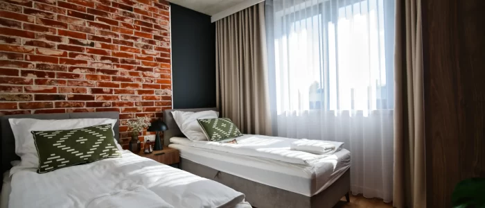 Apartment for 6 - bedroom with 2 single beds shot from a side
